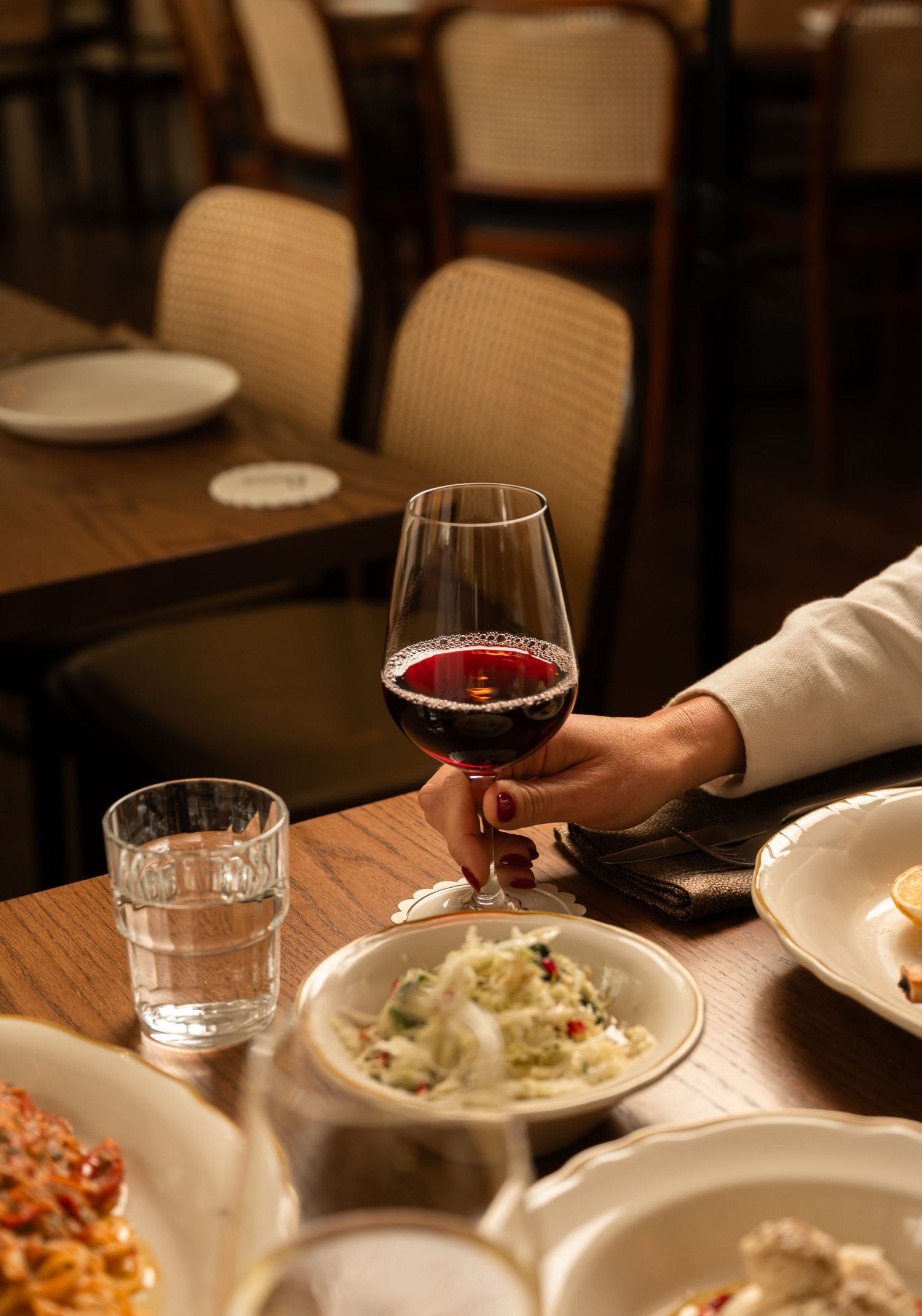 Wine and dining photography showcasing relaxed hospitality experience in contemporary restaurant setting