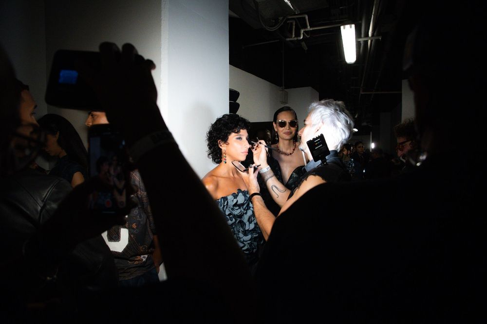 Backstage moment with models lit by cameras and crew | BTS Fashion Photography by Dario Hudon-Verrelli, Le Café Studio
