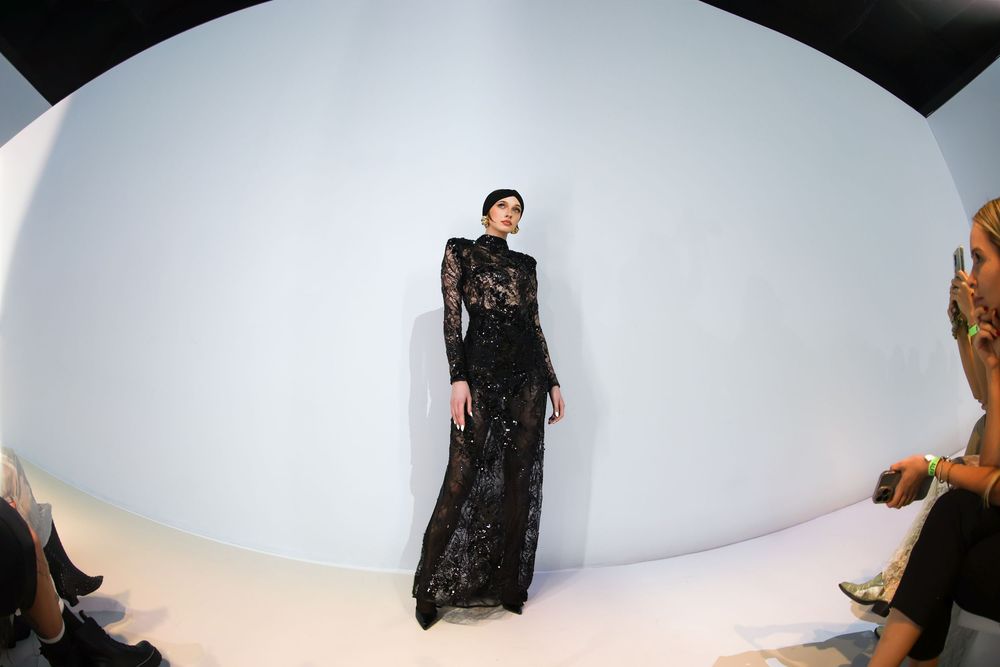 Runway model in long black gown under spotlight | Editorial Fashion Photography by Dario Hudon-Verrelli, Le Café Studio