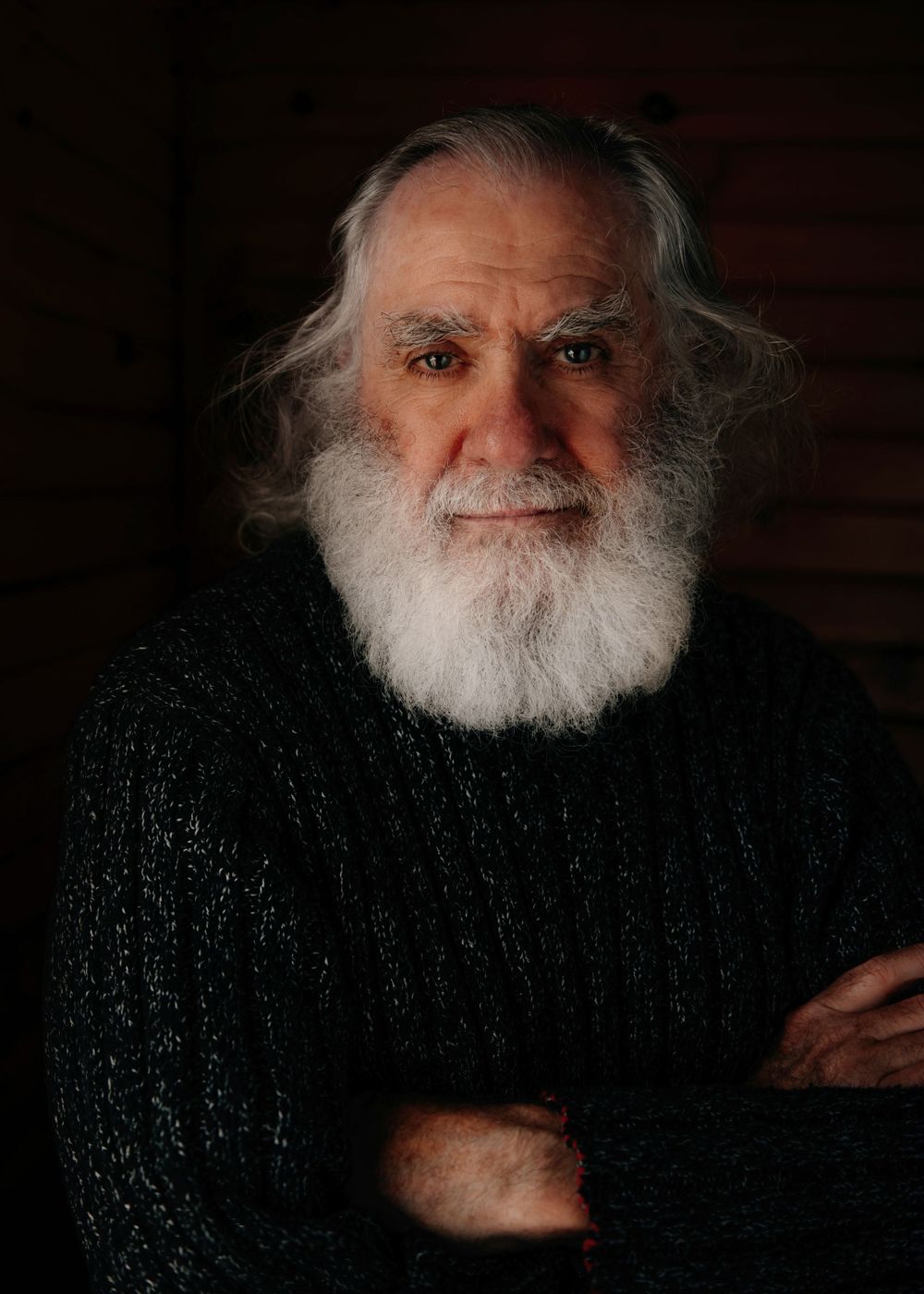 Close-up portrait of older man  with grey beard wearing dark sweater, Okanagan portrait photo by Tania Veitch.