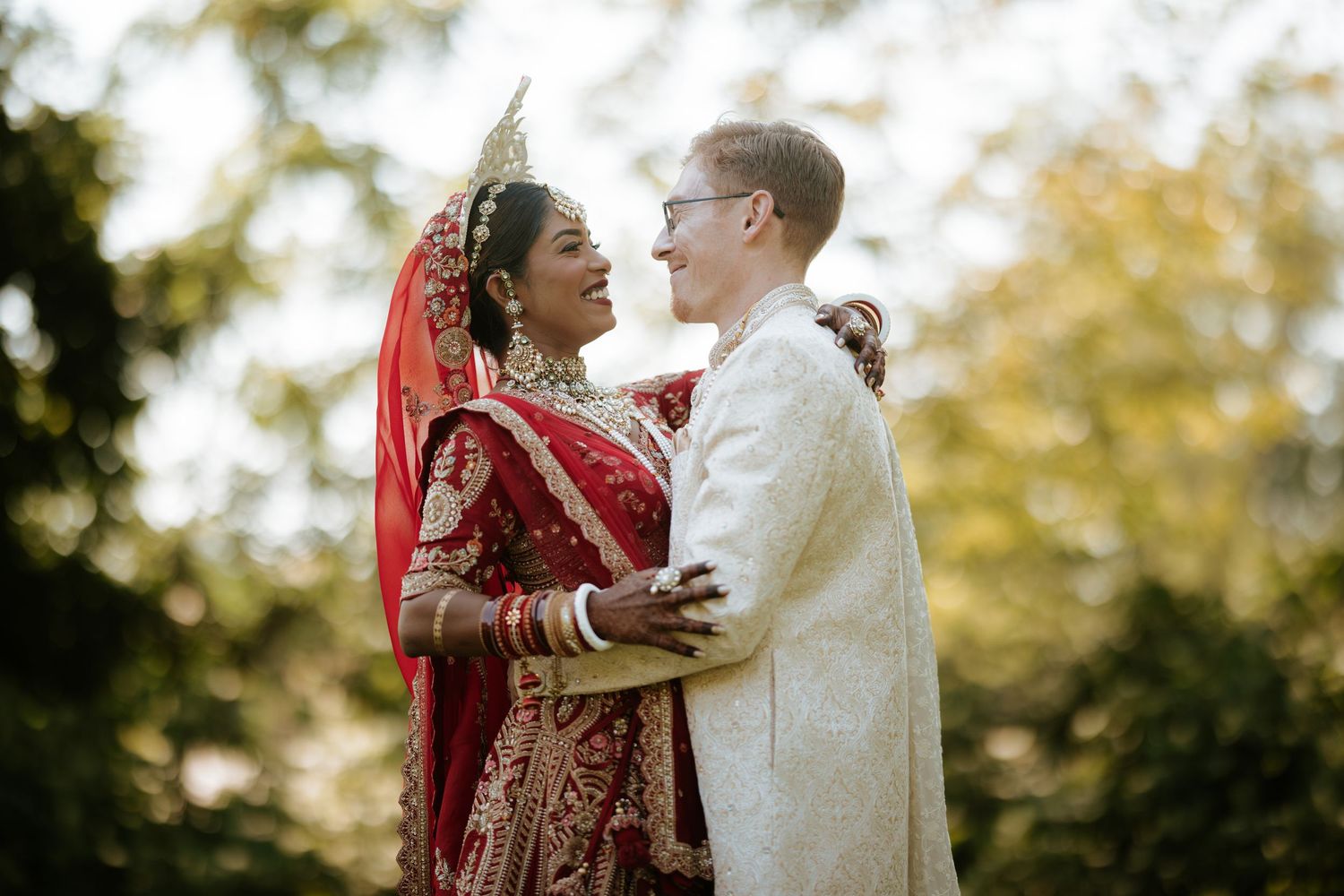 Elegant South Asian wedding at Downtown Marriott Philadelphia, with the couple glowing beneath a stunning floral mandap.