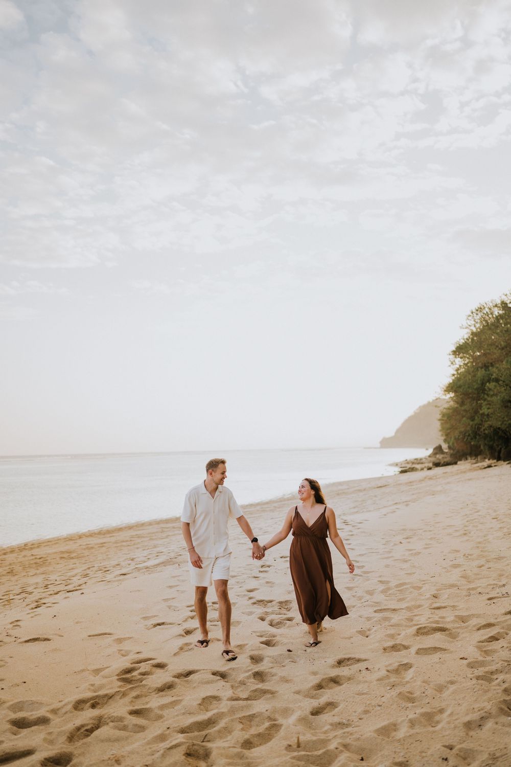 Romantic engagement photoshoot at Samabe Bali with beautiful ocean view backdrop