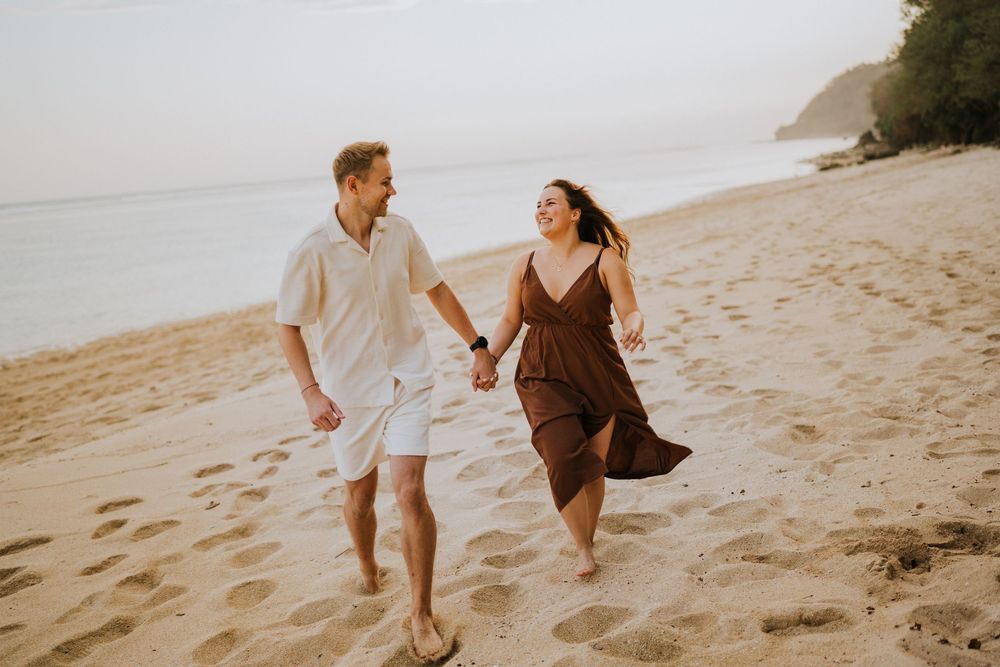 Romantic engagement photoshoot at Samabe Bali with beautiful ocean view backdrop