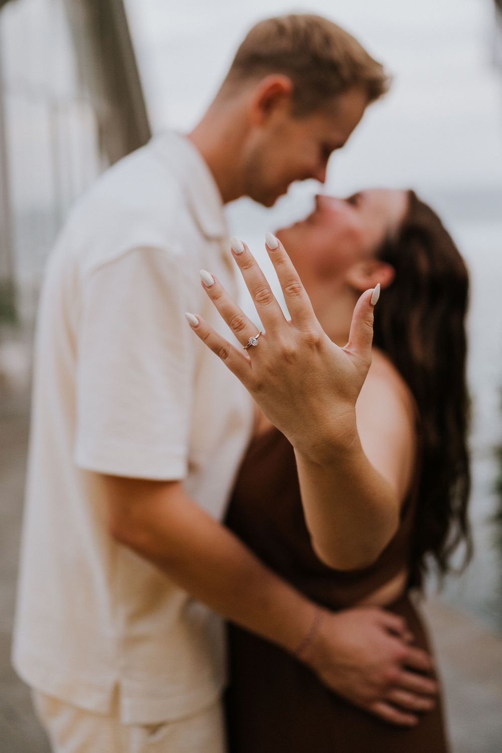 Romantic engagement photoshoot at Samabe Bali with beautiful ocean view backdrop