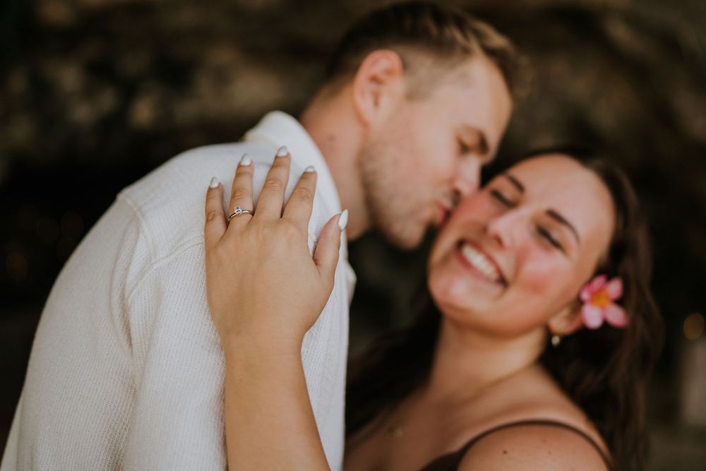Romantic engagement photoshoot at Samabe Bali with beautiful ocean view backdrop