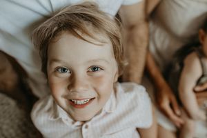 A series of candid expressions and joyful smiles captured in a warm, intimate photo collage.