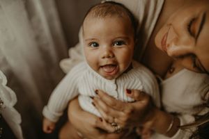 A collection of candid sepia-toned photos showing joyful expressions and intimate family moments.