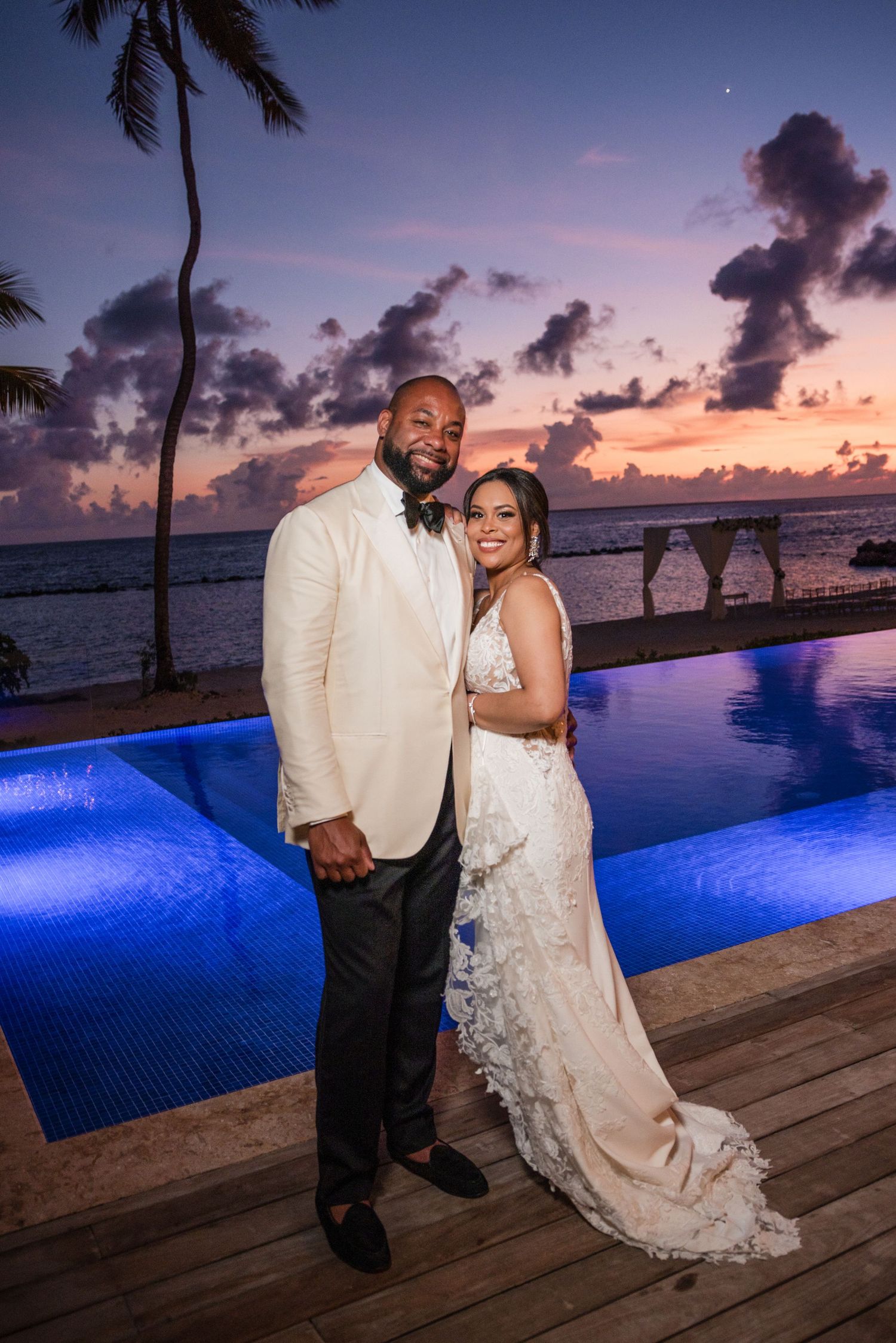 Elegant wedding couple dancing on curved stone steps in black and white. Minutes Beach club