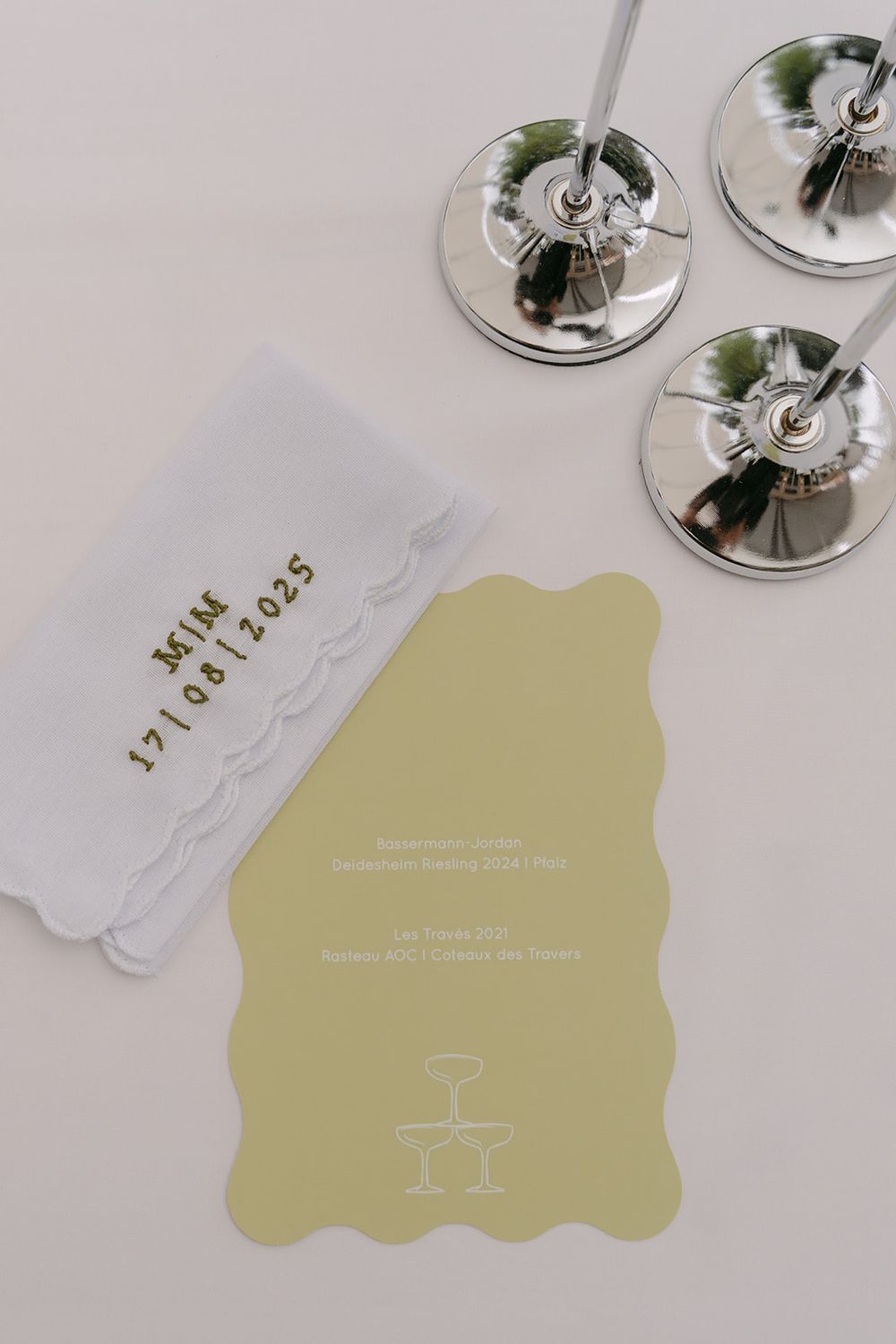 Wedding menu cards with champagne glass illustrations in soft gold tones.