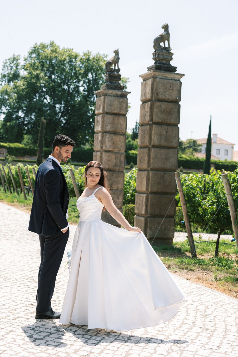 Romantic bride and groom portrait in the gardens of Palácio da Bacalhôa Portugal