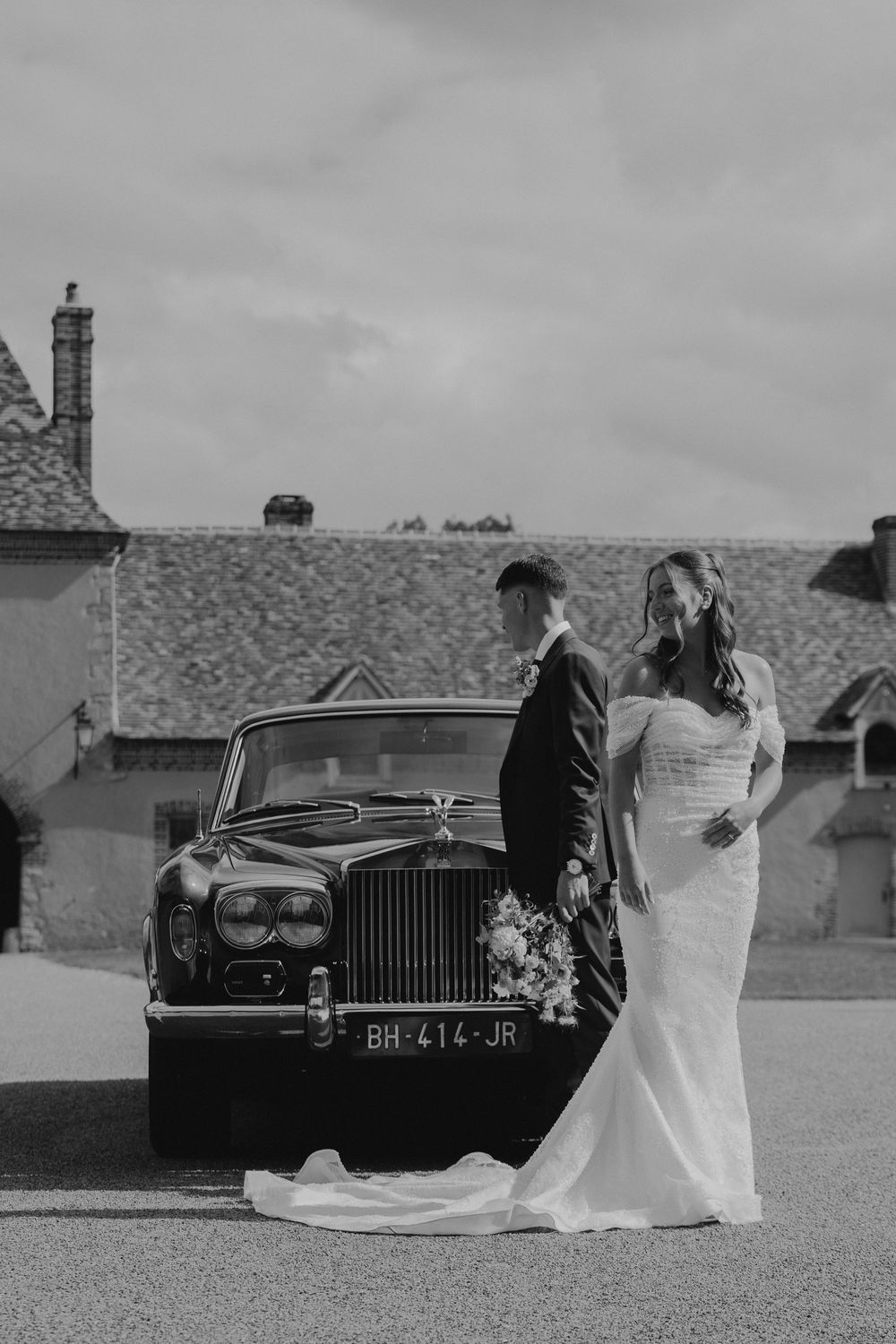 Classic vintage Rolls Royce car parked at an elegant wedding venue.