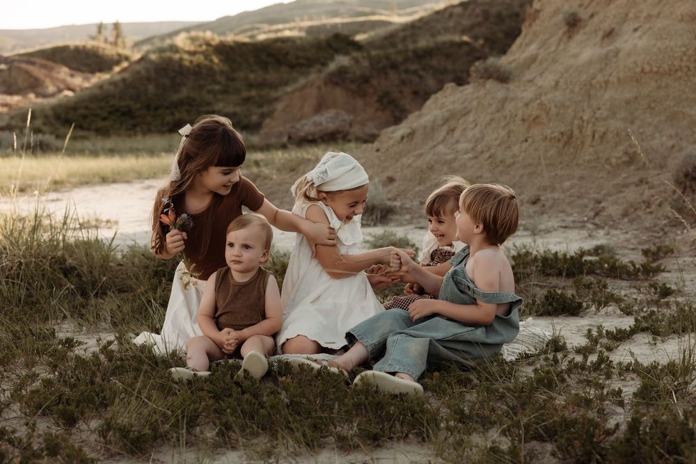 kids playing happily while photographer captures the moment in alberta