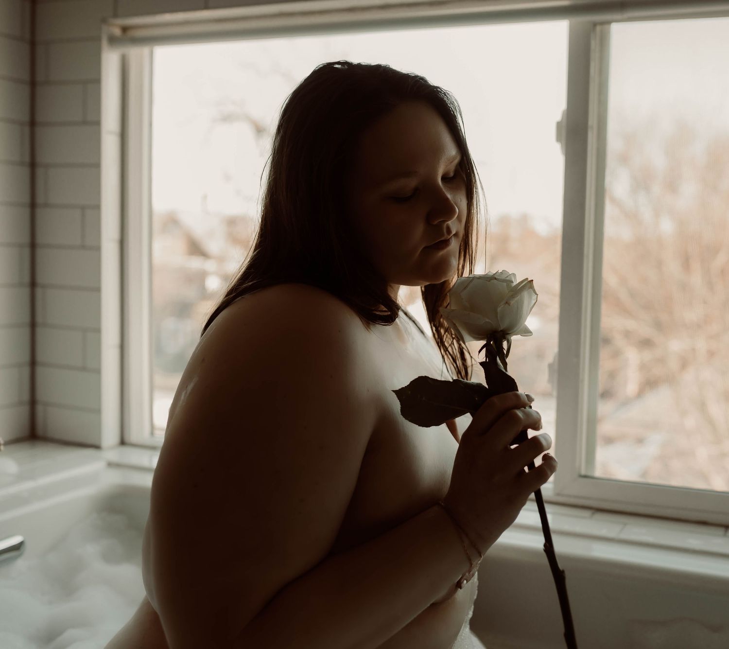 Dark and moody boudoir portrait of woman in Minneapolis Minnesota.