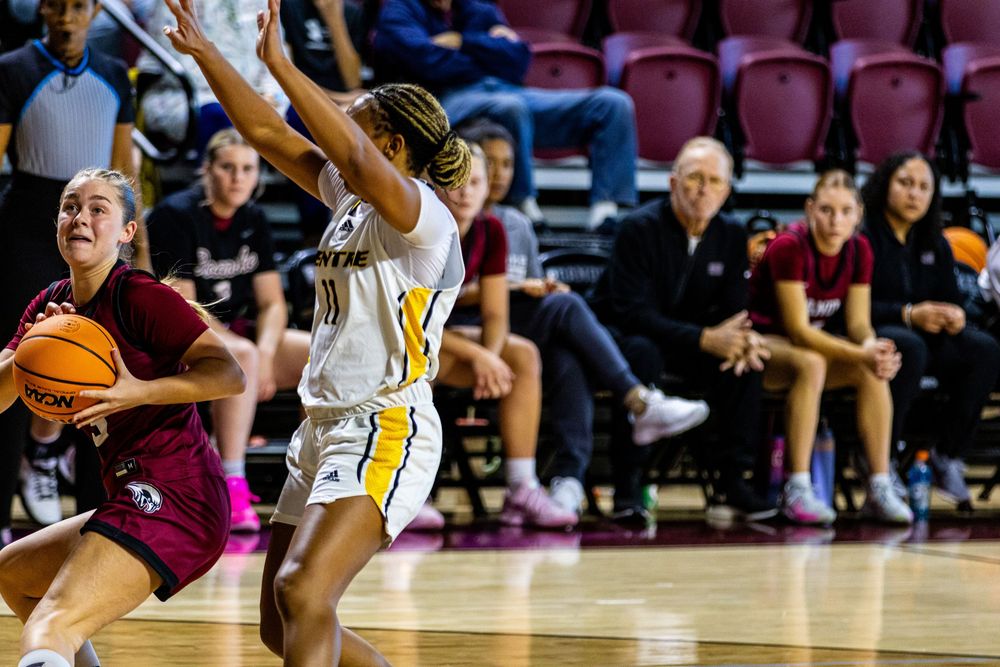 Maroons women’s basketball player shooting a three pointer Roanoke College