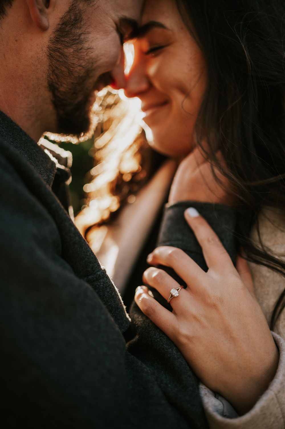 Professional photo of engagement couple on Mt. Washington detail shot of faces and ring in Paradise Meadows Vancouver Island