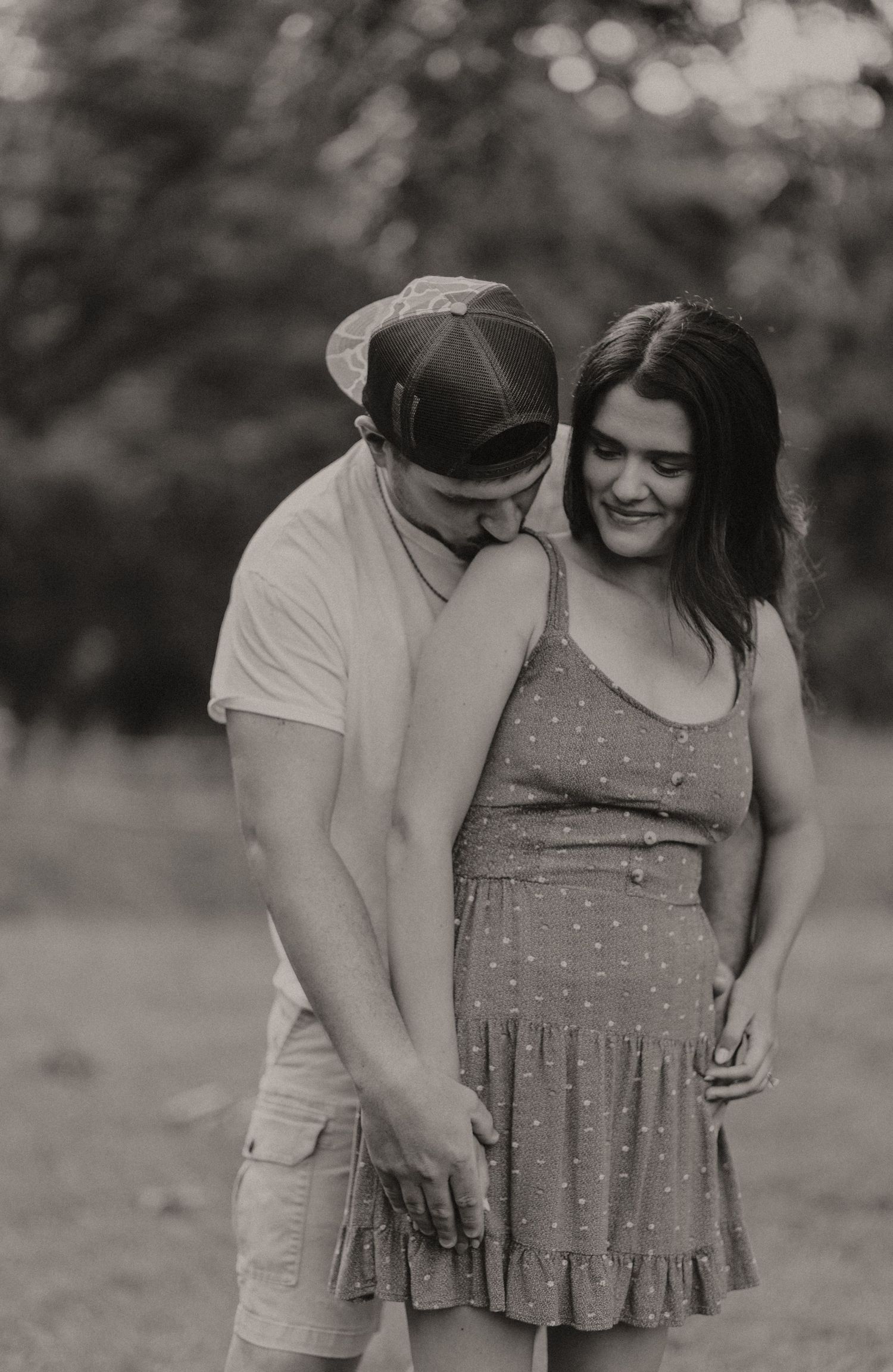 Intimate black and white portrait sequence showing tender moments between two people.