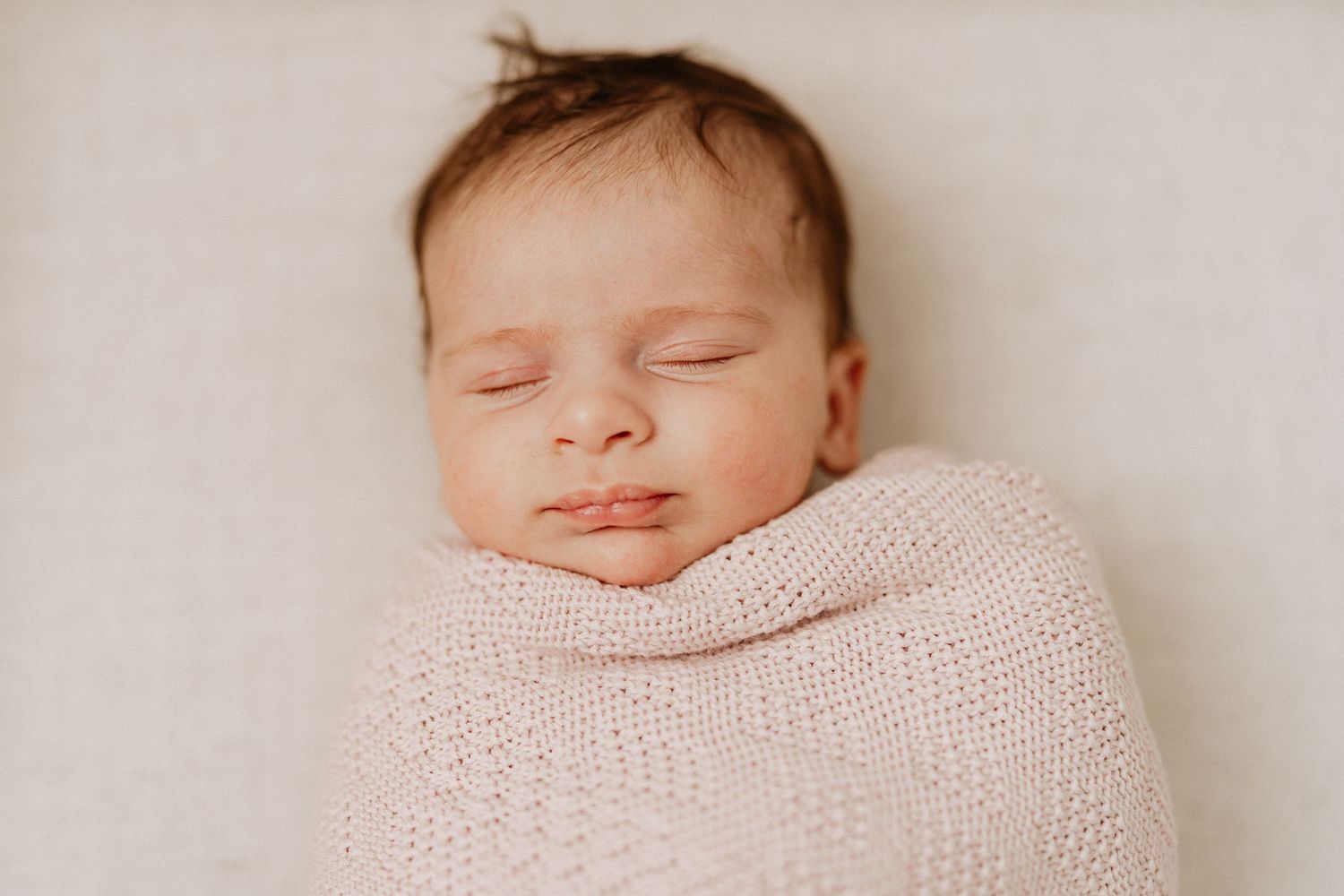 Sleeping newborn baby portrait during an indoor newborn photography session in Perth