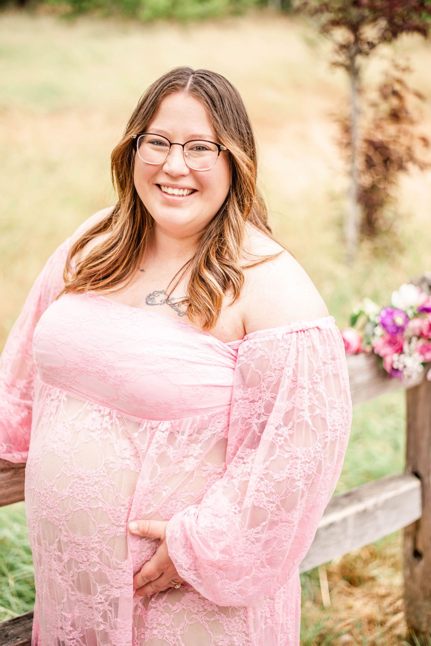 Portrait series featuring someone in a pink lace dress posing near wooden fencing with flowers.