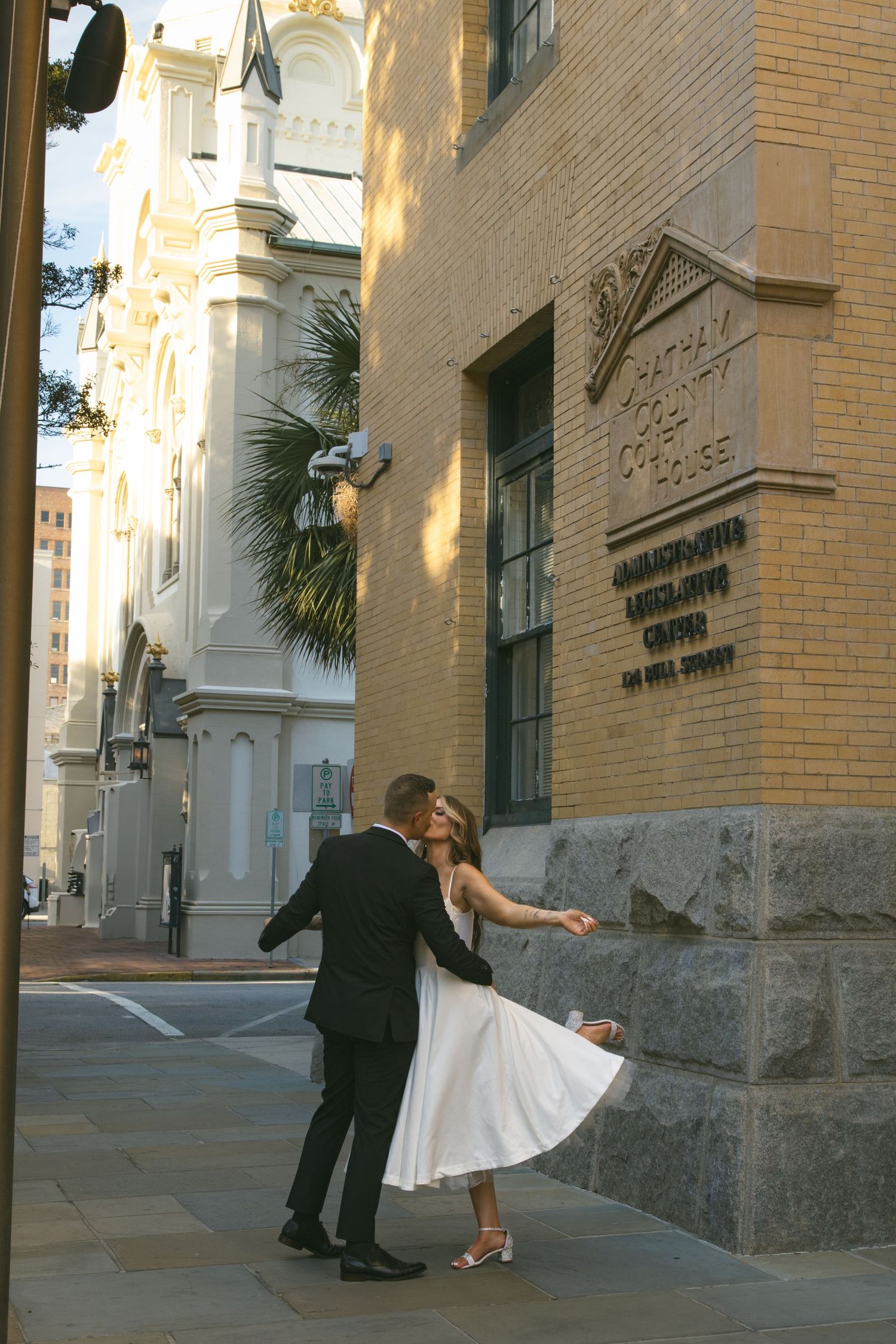 couple celebrating kissing after elopement courthouse wedding GA SC NC TN