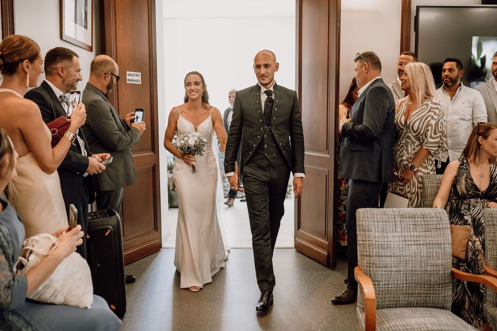 A series of wedding photos showing guests and couples in a hallway and reception venue during a celebration.