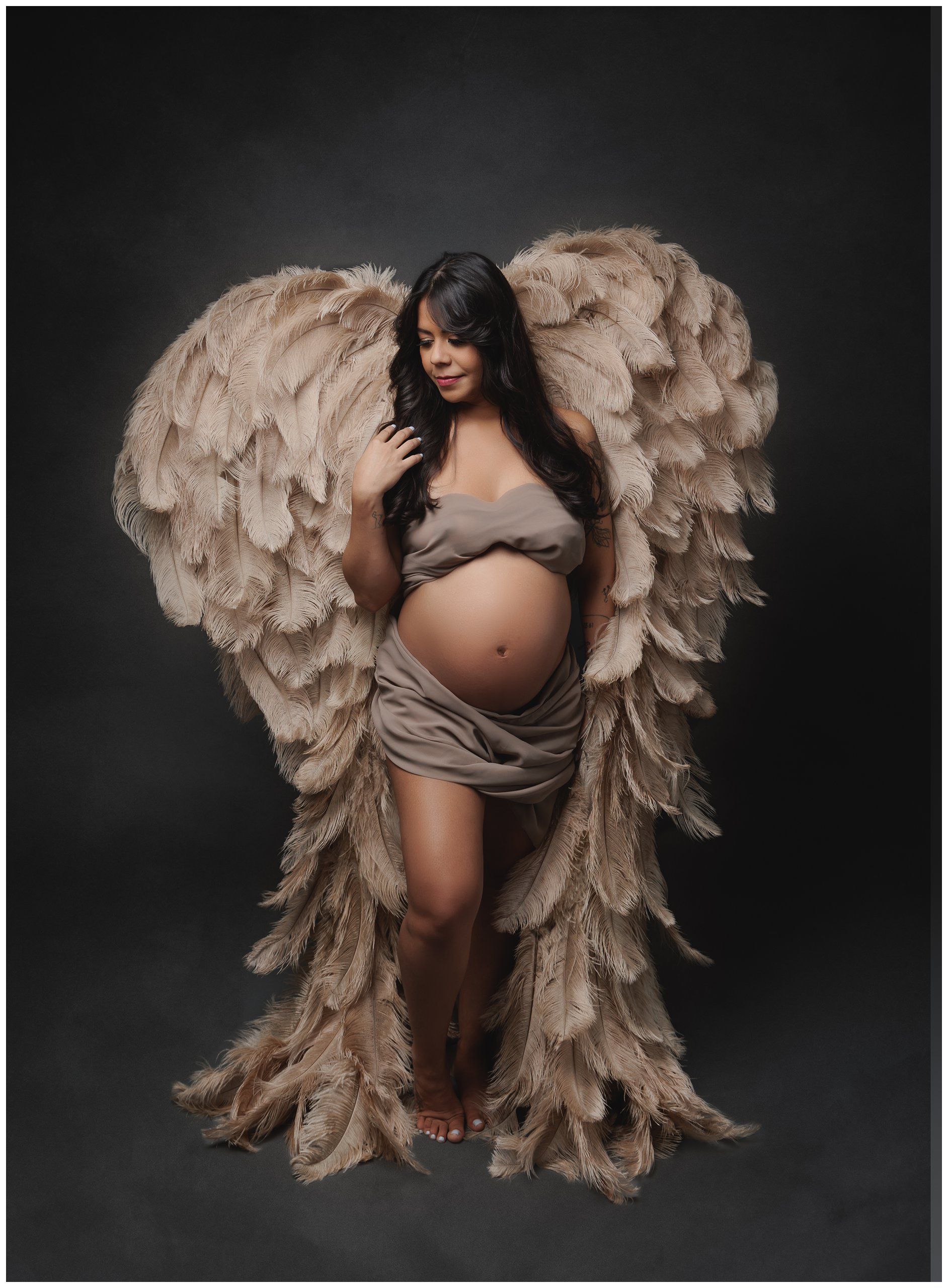 Fine art maternity portrait with angel wings featuring expecting mother photographed in Austin studio by Valerie Kay Photography