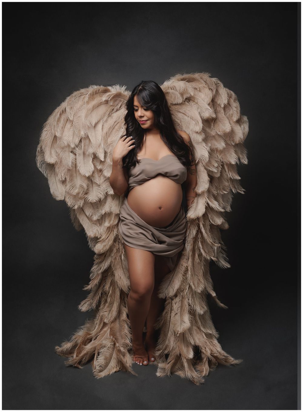 Fine art maternity portrait with angel wings featuring expecting mother photographed in Austin studio by Valerie Kay Photography