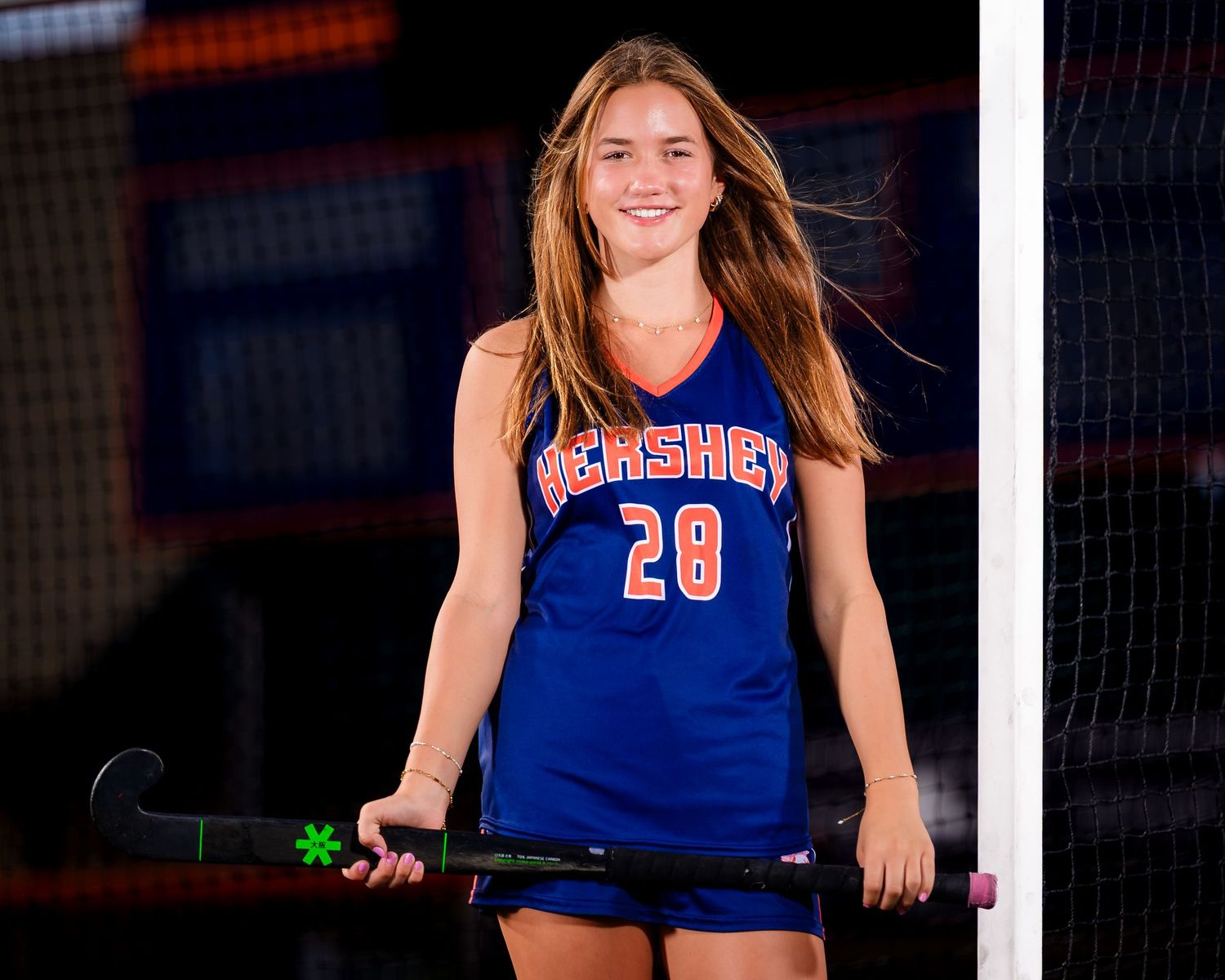 Hershey Trojans field hockey player, #28, individual portrait at the goal, by Deanna Fox, SportsFox Photography based in Hershey PA