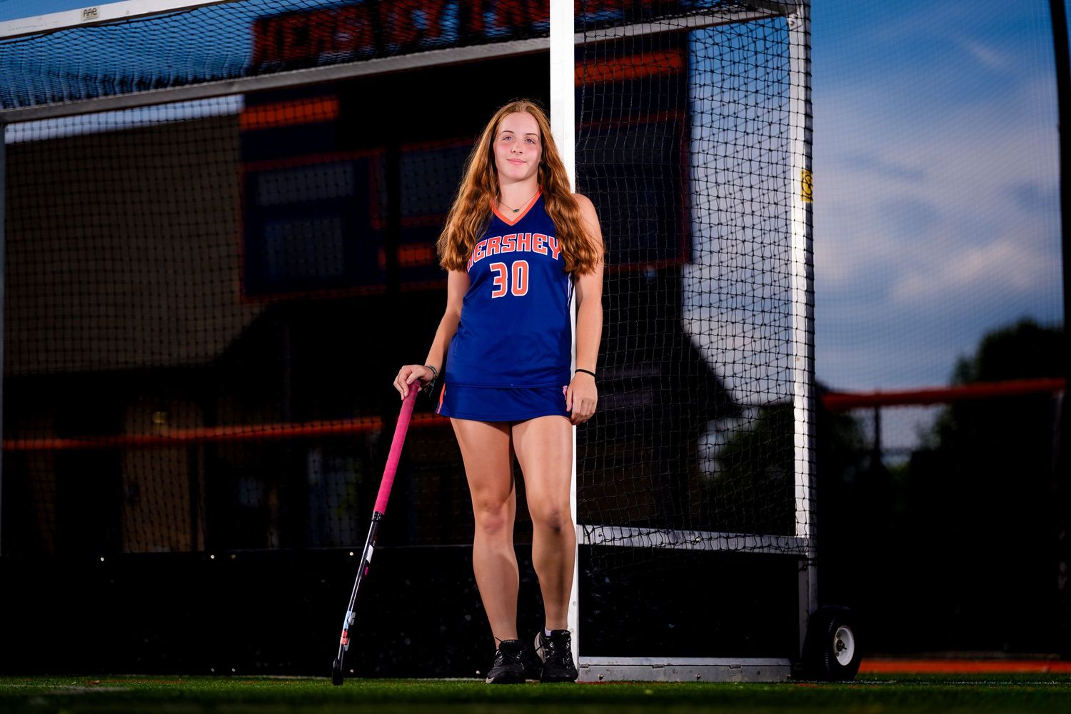 Hershey Trojans field hockey player, #30, individual portrait at the goal, by Deanna Fox, SportsFox Photography based in Hershey PA