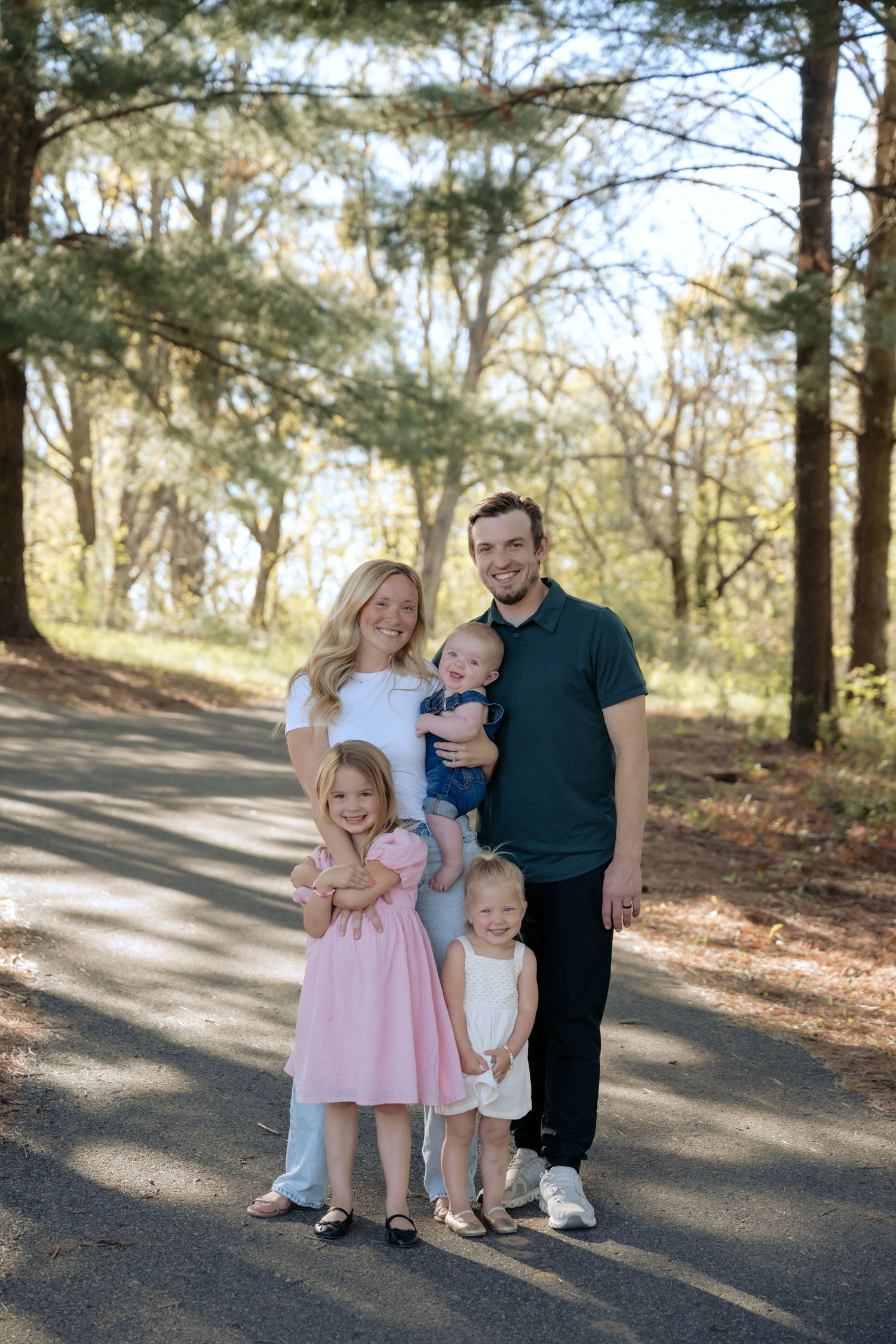 family portraits in wooded WI park for outdoor spring family photos in Hudson, WI