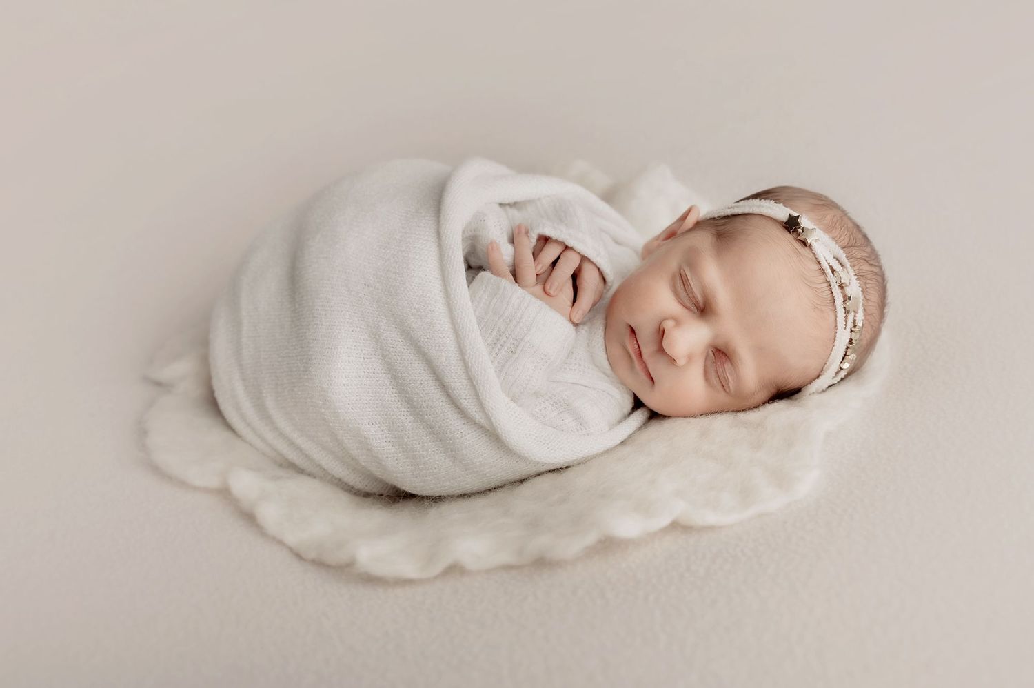 Newborn baby sleeping during professional portrait session