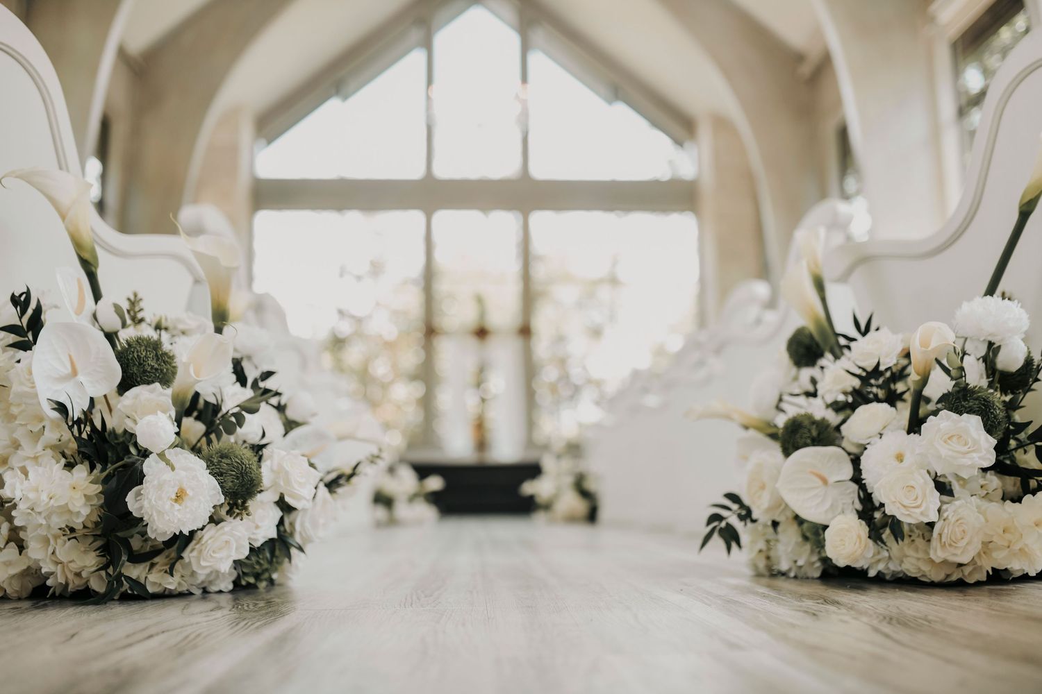 Crystal chandeliers and floor-to-ceiling windows inside Brighton Abbey chapel