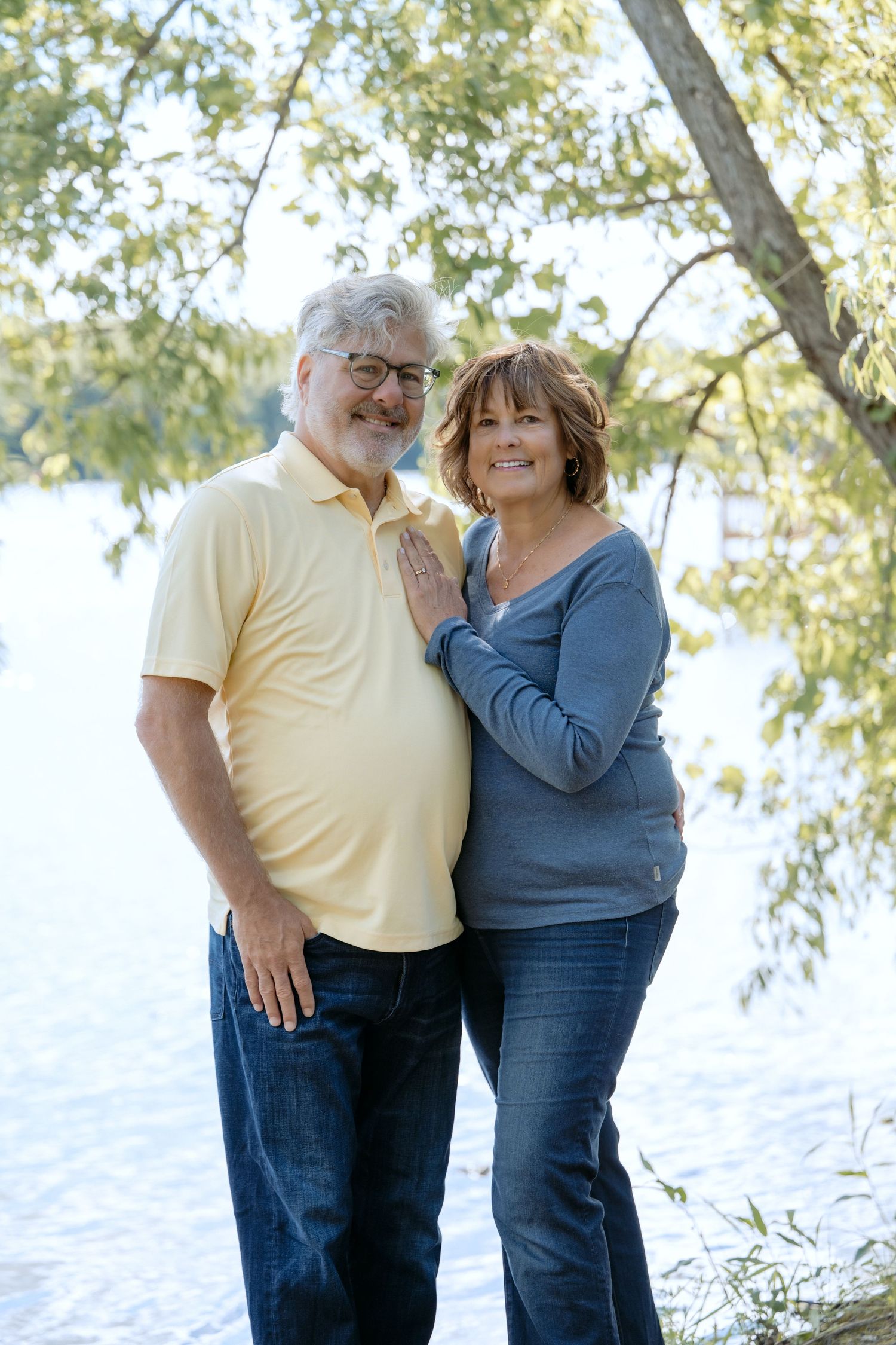 beautiful portrait of grandma and grandpa in front of the water during extended family portrait at powers lake park in woodbury mn