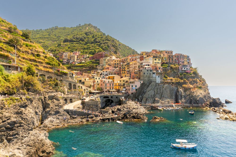 Stunning view of Manarola village in Cinque Terre with its colorful houses perched on coastal cliffs.