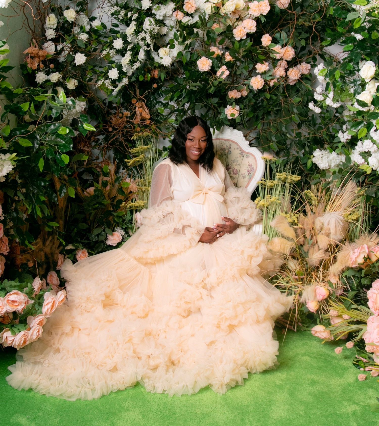 Romantic garden photoshoot with flowing white dress among blooming roses.
