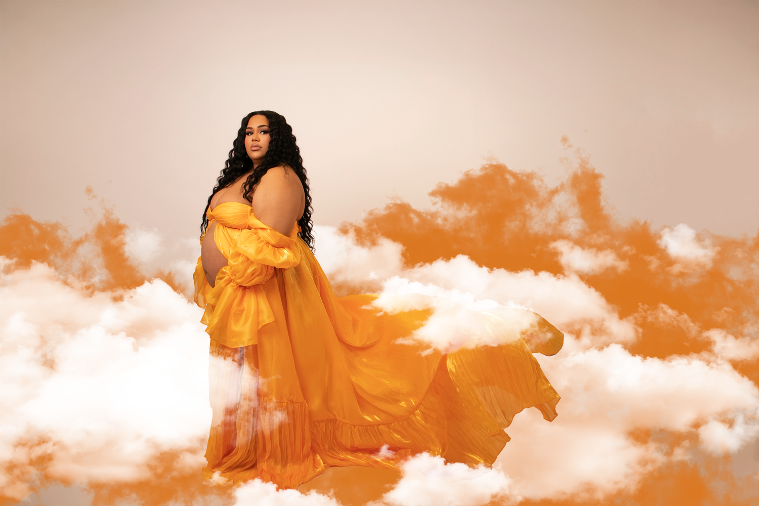 An artistic fashion photo series in flowing orange dress with dramatic lighting and clouds.