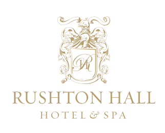 Elegant gold monogram logo for Rushton Hall Hotel & Spa featuring ornate scrollwork and heraldic design elements.