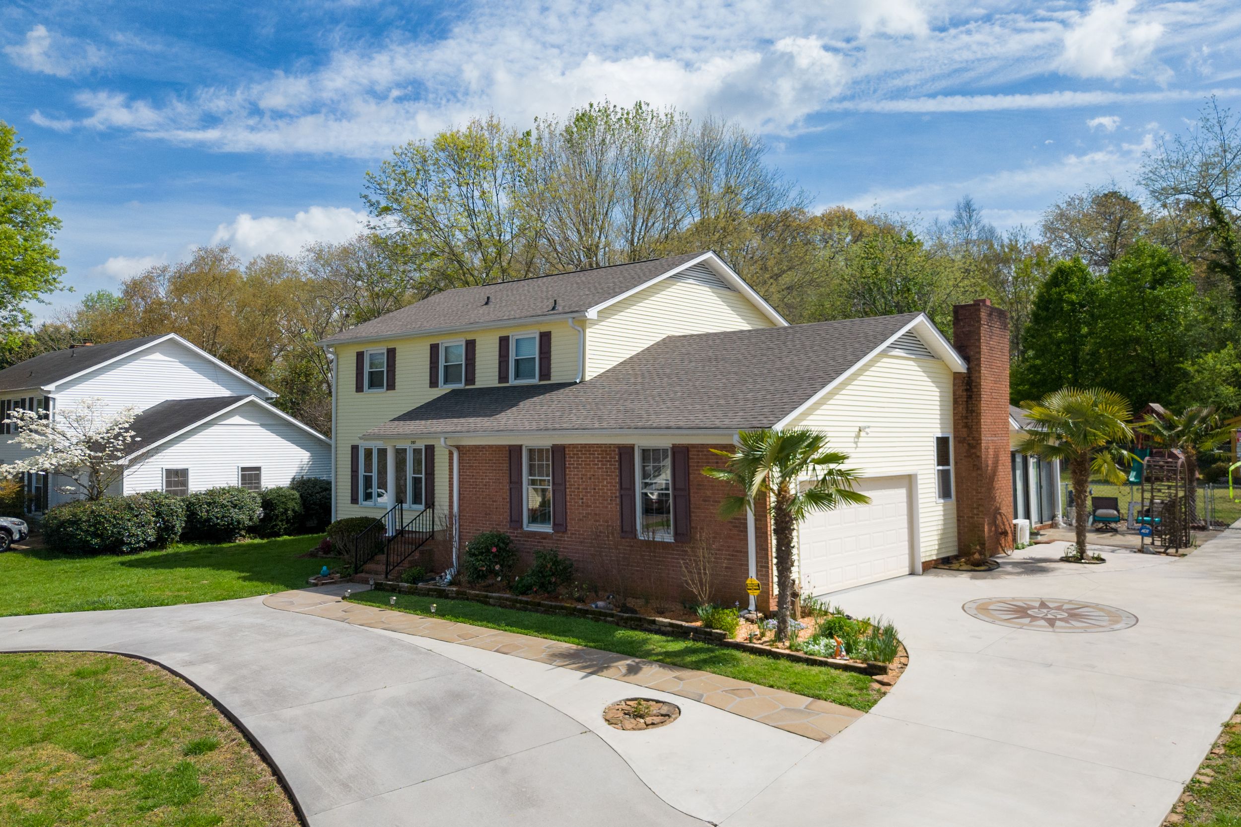 Detached home with landscaped yard and great curb appeal, taken by local photographer in Windsor Ontario.