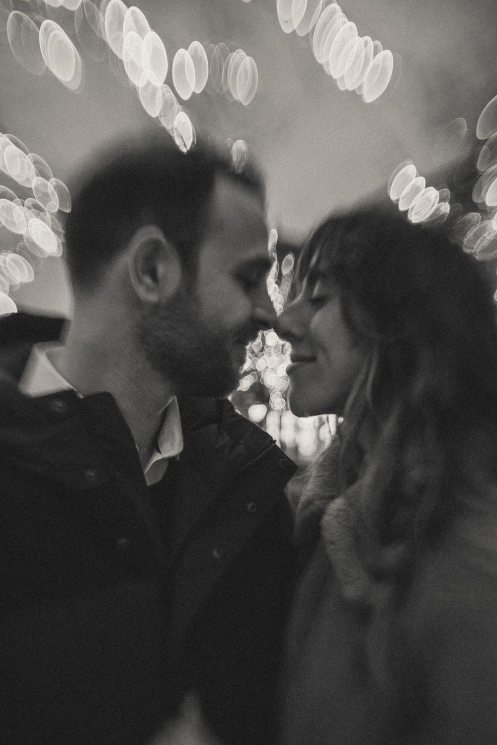 Artistic black and white photo with bokeh lights creating a dreamy atmosphere.