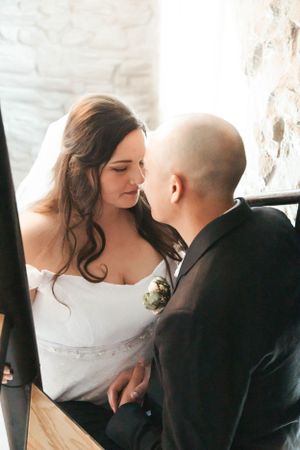 A tender moment shared between newlyweds during their wedding celebration.