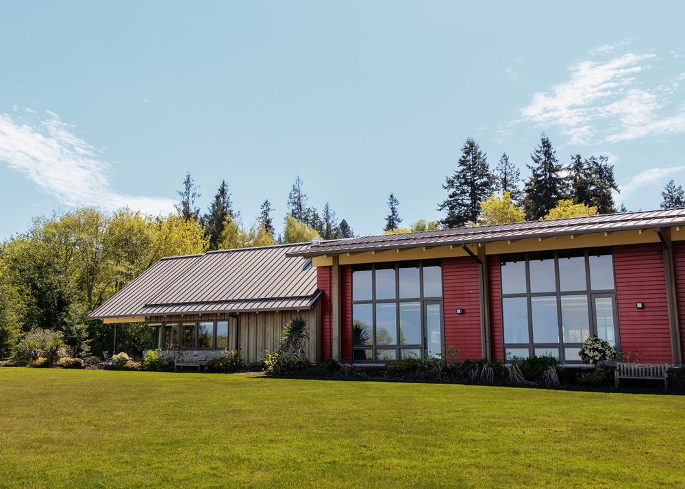 Exterior of Rosehill Community Center featuring the green lawn and landscaping on a bright, sunny day
