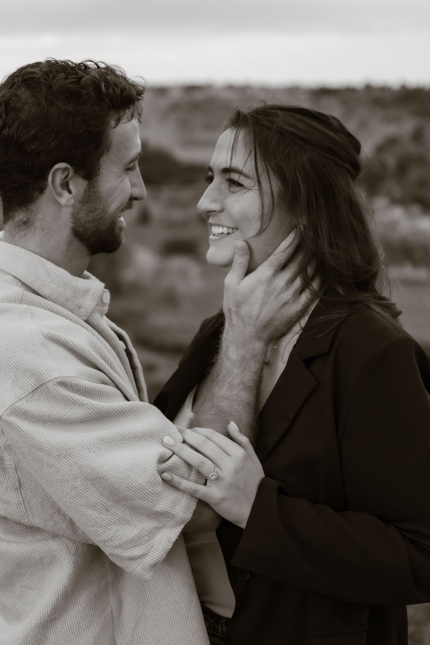 A romantic black and white sequence shows a tender moment between two people.