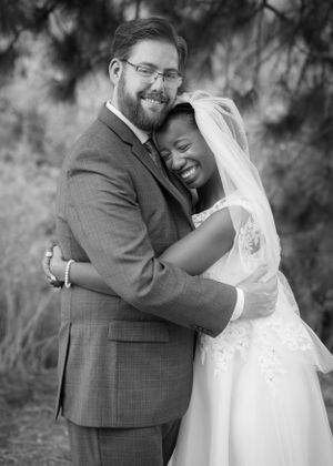 Black and white wedding portrait capturing a newly married young couple.