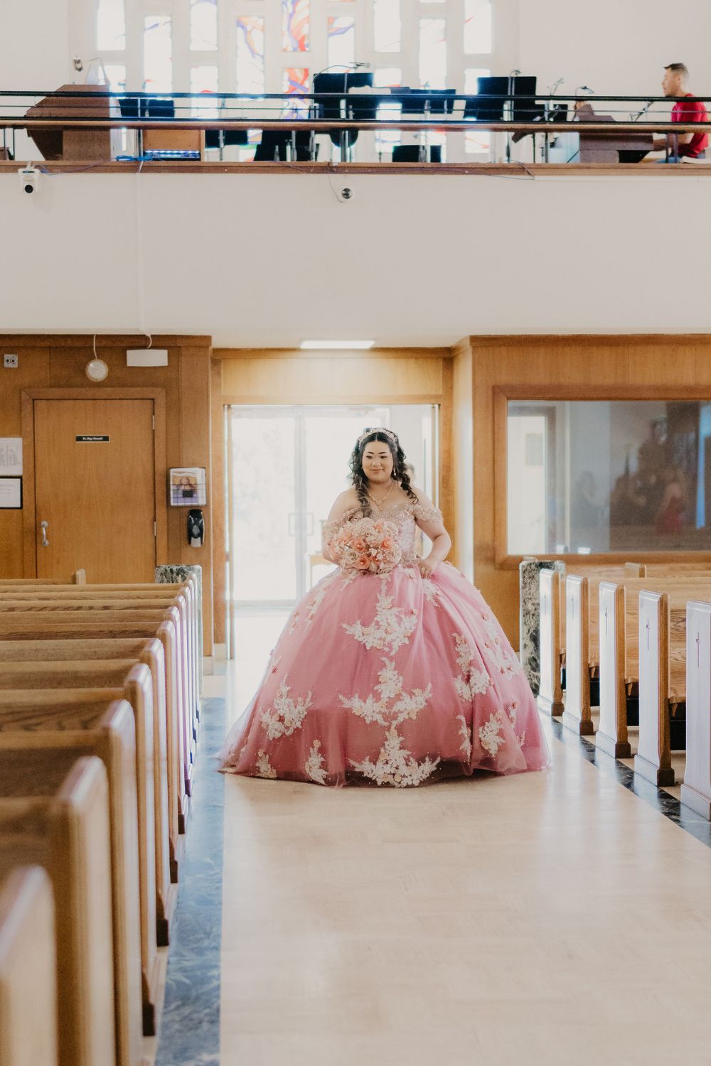 Quinceañera walking through venue doors, grand entrance, oak ridge catholic church