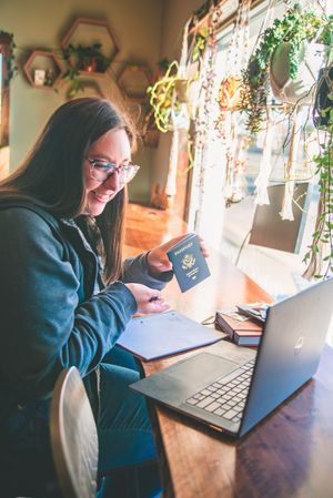 travel agent meets with client on computer