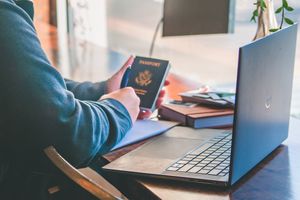 travel agent detail photo working at laptop