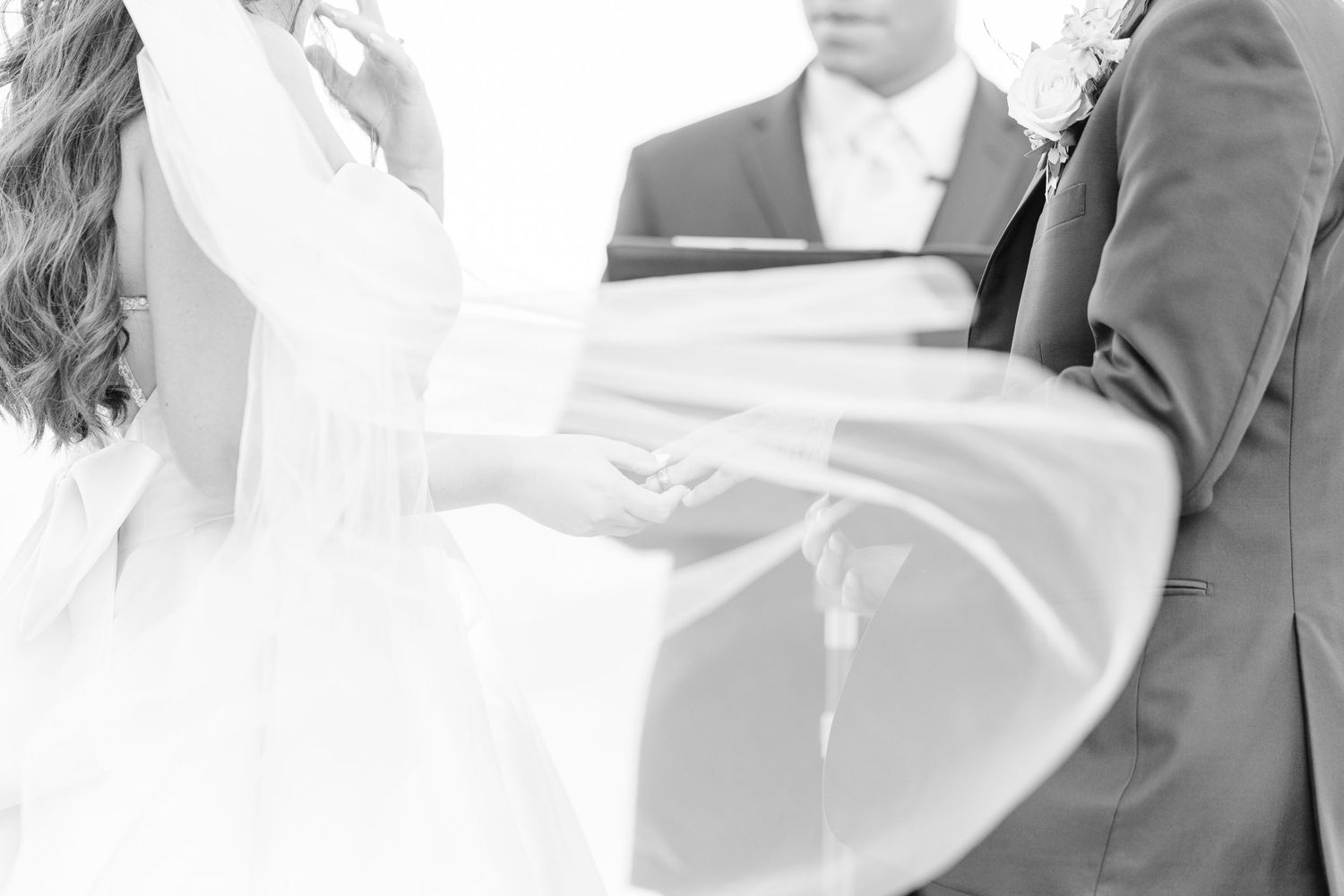 Wedding couple and guests dance together on an elegant ballroom floor during an event celebration.