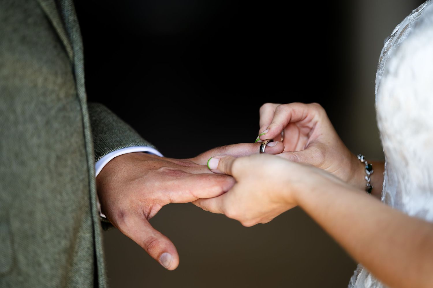 Professional massage therapist performing firm pressure hand techniques on a client's arm during a therapeutic session.