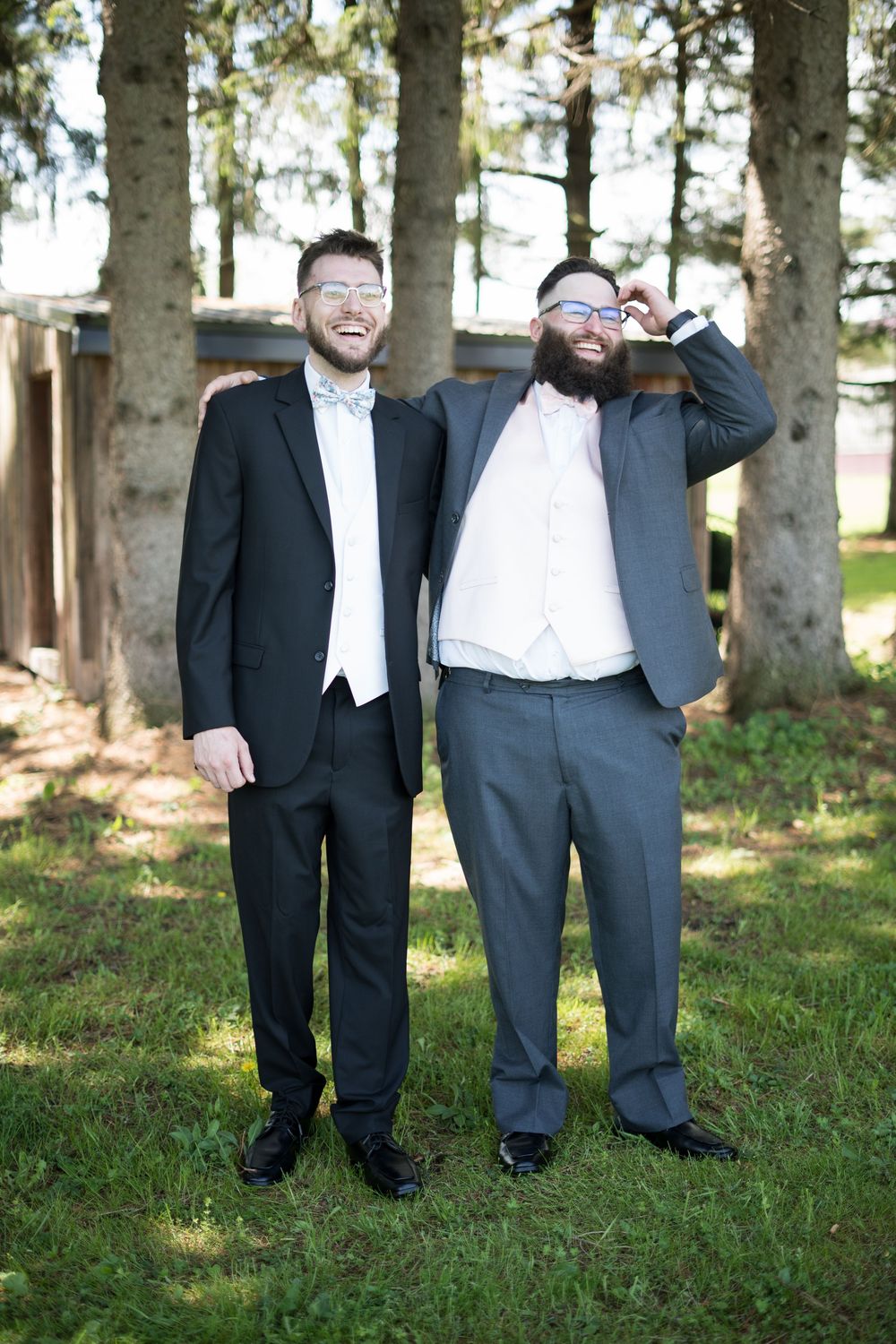 A series of photos showing two wedding attendees in formal attire standing together outdoors under tall trees.