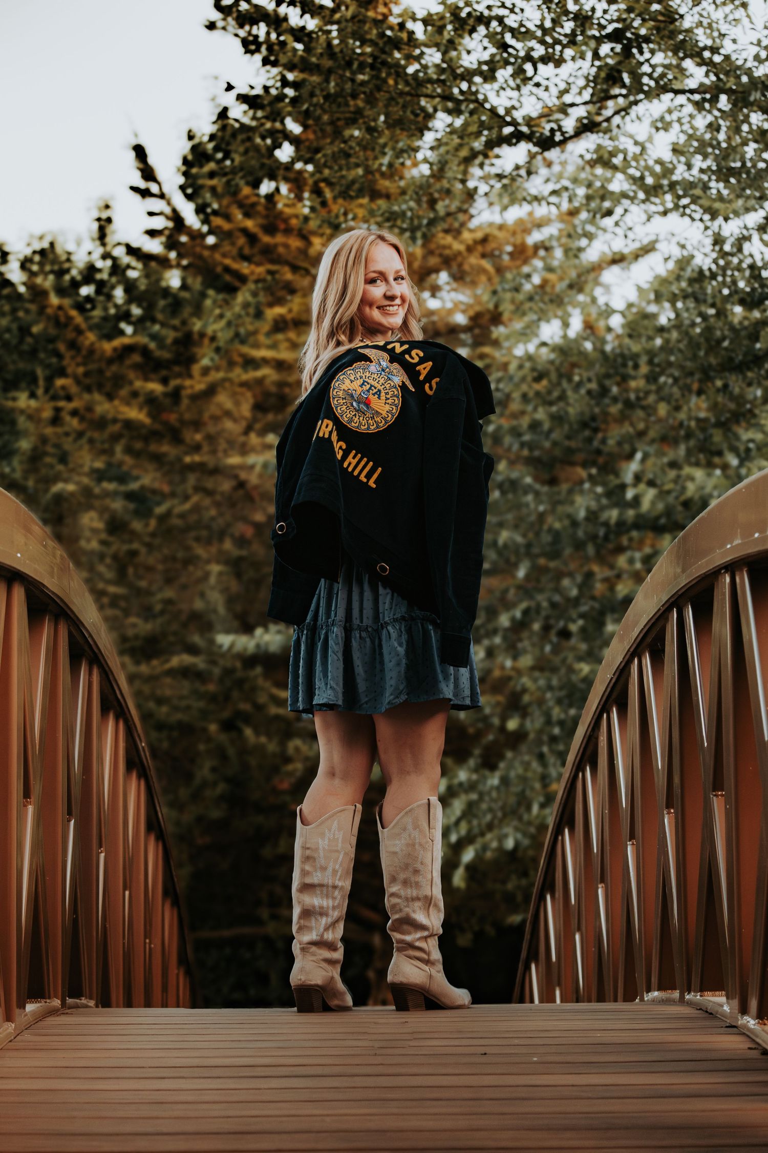 Series of photos showing couple's feet on a rustic wooden bridge during autumn with fall foliage in background.