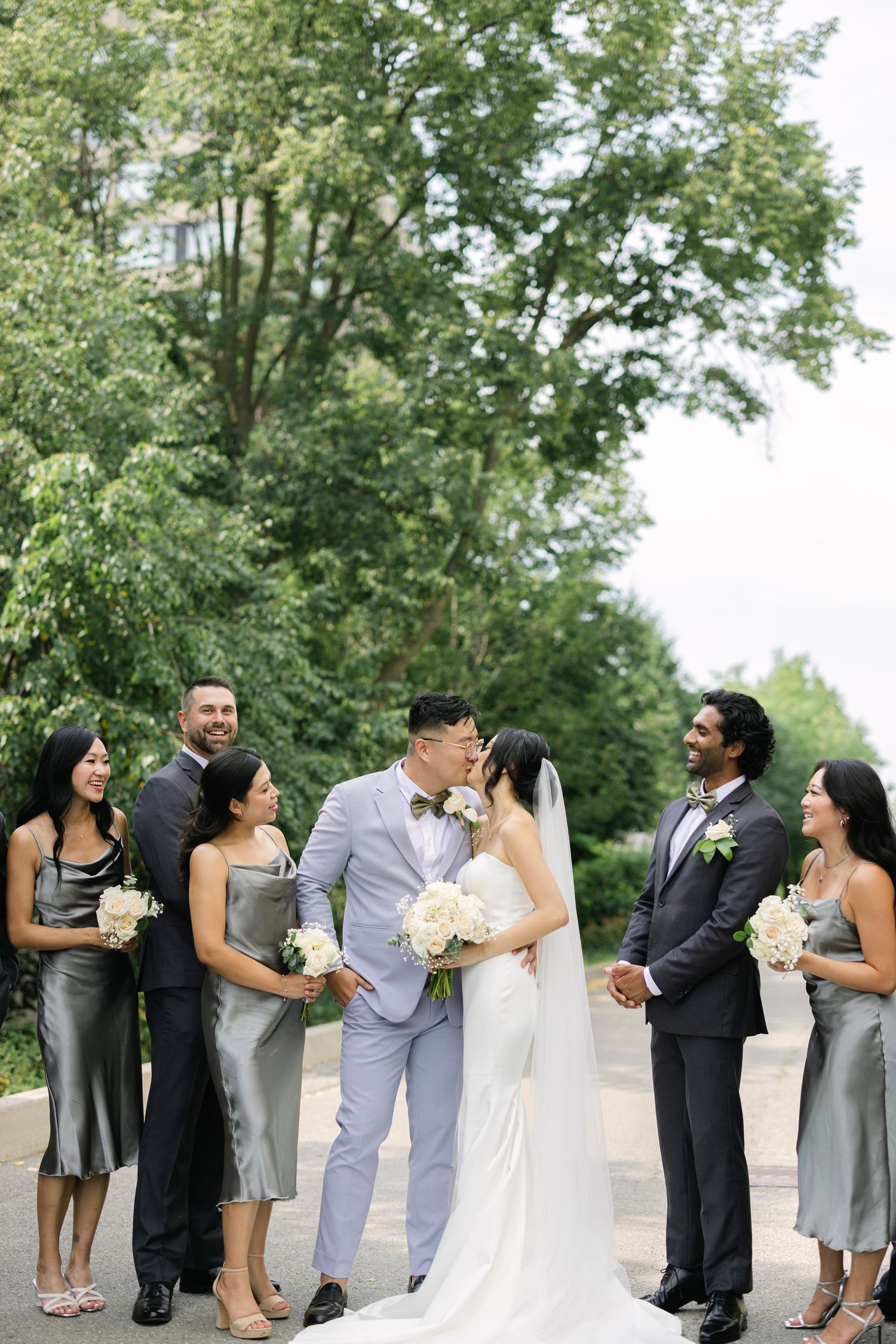 Candid wedding portrait of bridal party laughing – Toronto wedding photography